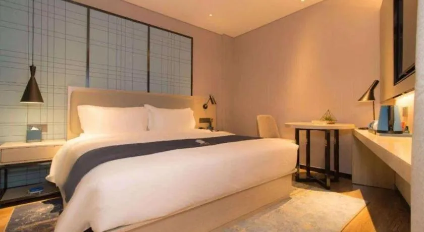 Bed in Echarm Hotel Changsha Wuyi Square Railway Metro Station