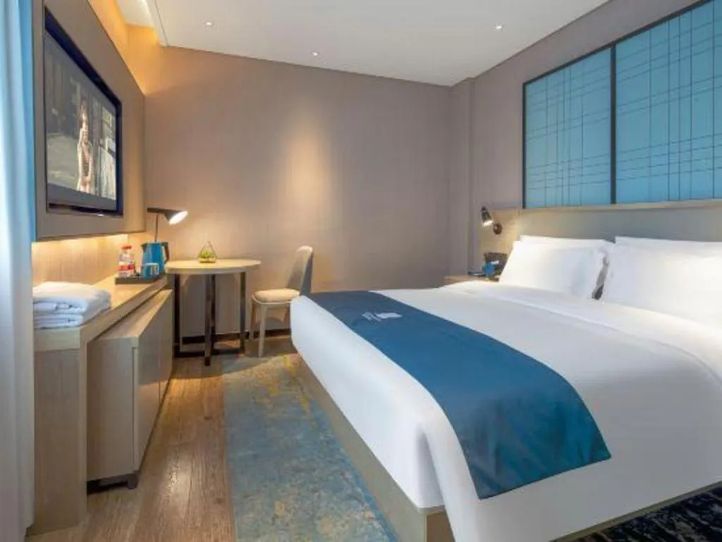 Bed in Echarm Hotel Changsha Wuyi Square Railway Metro Station