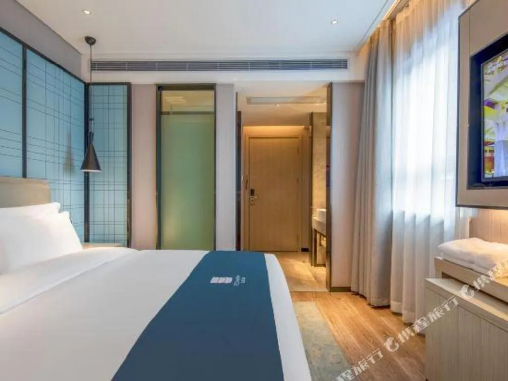 Bed in Echarm Hotel Changsha Wuyi Square Railway Metro Station