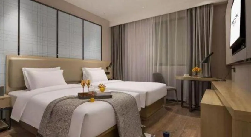 Bed in Echarm Hotel Changsha Wuyi Square Railway Metro Station