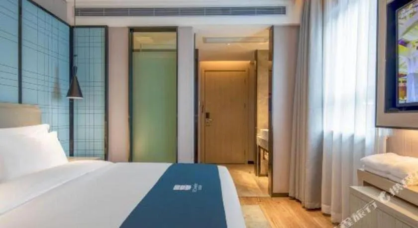 Bed in Echarm Hotel Changsha Wuyi Square Railway Metro Station
