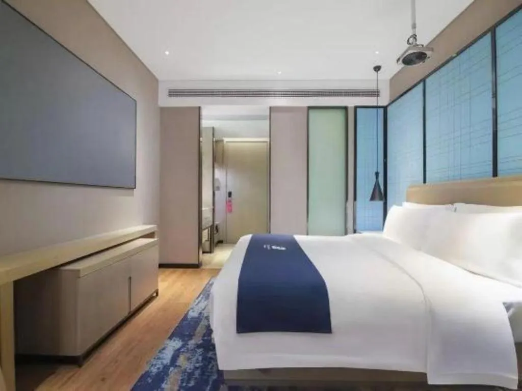 Bed in Echarm Hotel Changsha Wuyi Square Railway Metro Station