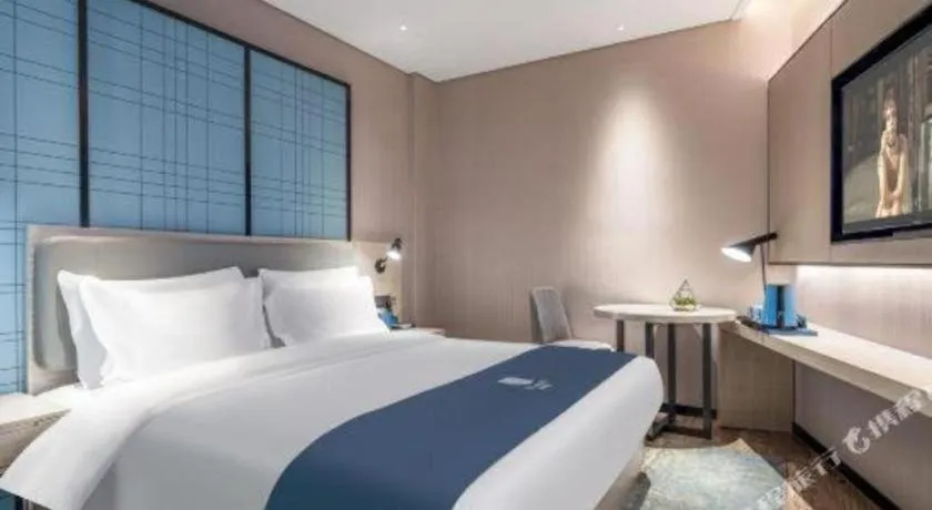 Bed in Echarm Hotel Changsha Wuyi Square Railway Metro Station