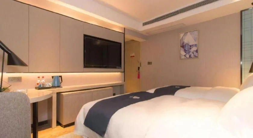 Bed in Echarm Hotel Changsha Wuyi Square Railway Metro Station