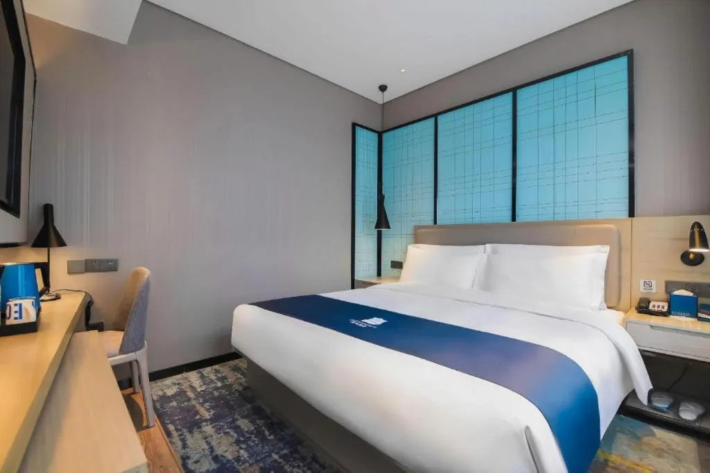 Bed in Echarm Hotel Changsha Wuyi Square Railway Metro Station