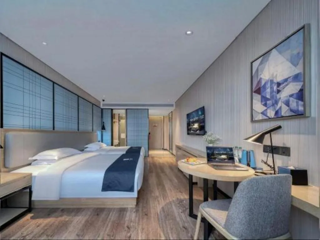 Bed in Echarm Hotel Changsha Wuyi Square Railway Metro Station