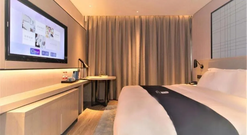 Bed in Echarm Hotel Changsha Wuyi Square Railway Metro Station