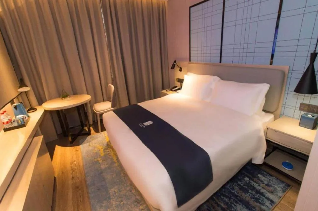 Bed in Echarm Hotel Changsha Wuyi Square Railway Metro Station