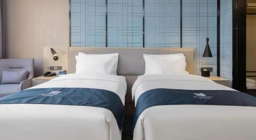 Bed in Echarm Hotel Changsha Wuyi Square Railway Metro Station