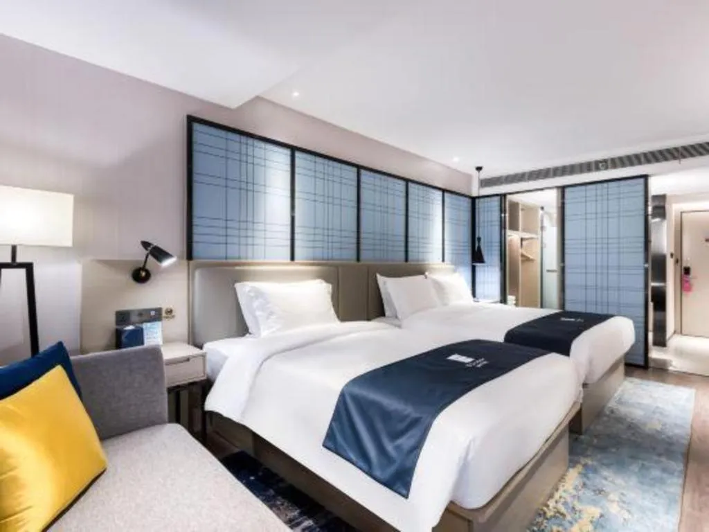 Bed in Echarm Hotel Huzhou Wuyue Plaza Children's Clothing City