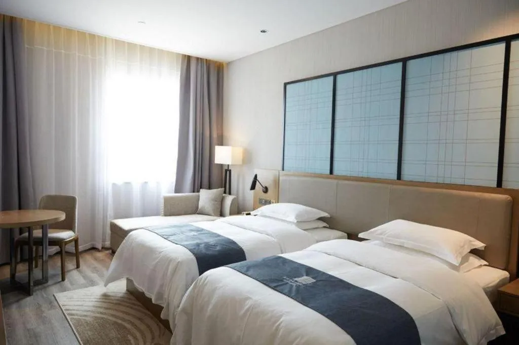 Bed in Echarm Hotel Huzhou Wuyue Plaza Children's Clothing City