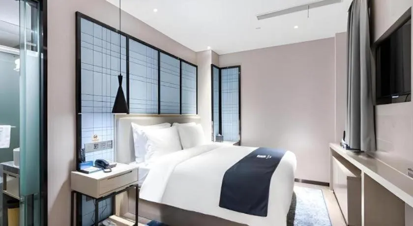 Bed in Echarm Hotel Huzhou Wuyue Plaza Children's Clothing City