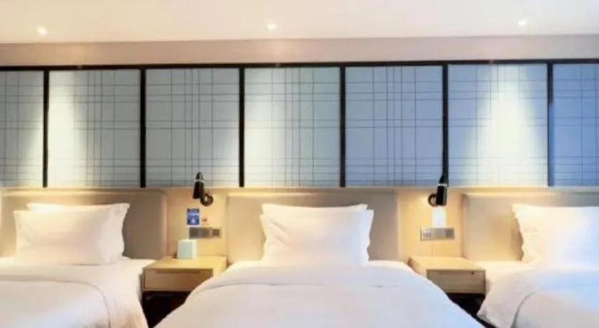 Bed in Echarm Hotel Huzhou Wuyue Plaza Children's Clothing City