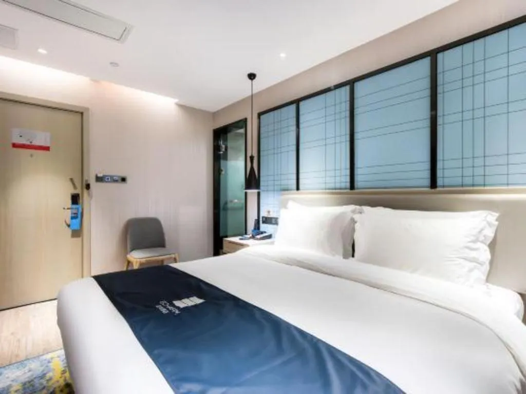 Bed in Echarm Hotel Huzhou Wuyue Plaza Children's Clothing City