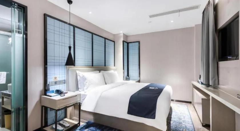 Bed in Echarm Hotel Huzhou Wuyue Plaza Children's Clothing City