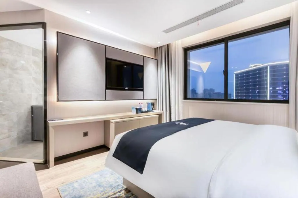 Bed in Echarm Hotel Huzhou Wuyue Plaza Children's Clothing City