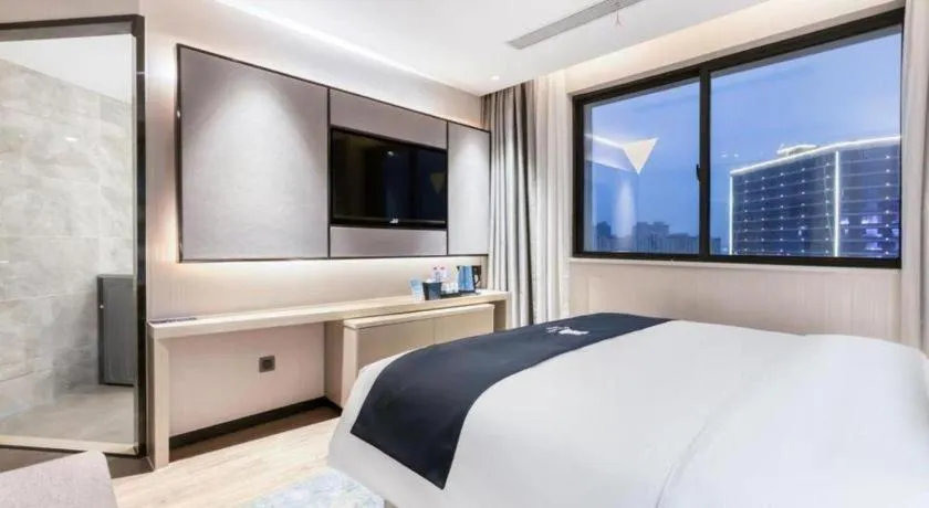 Bed in Echarm Hotel Huzhou Wuyue Plaza Children's Clothing City