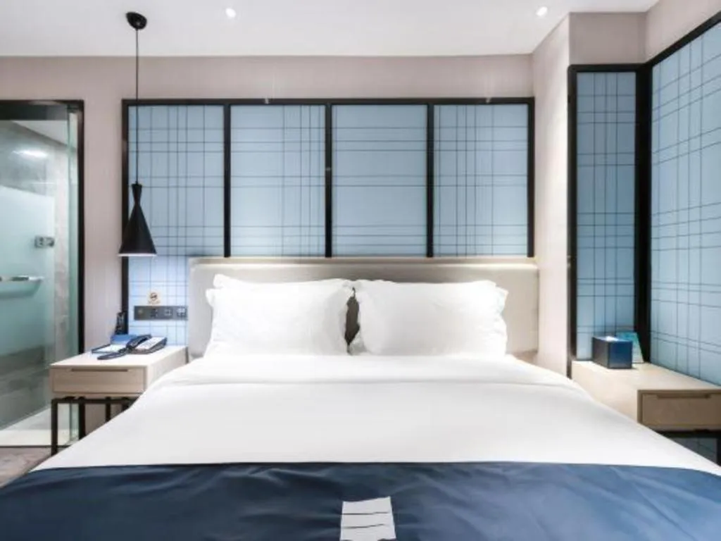 Bed in Echarm Hotel Huzhou Wuyue Plaza Children's Clothing City