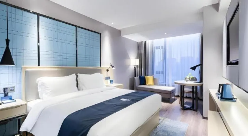 Bed in Echarm Hotel Huzhou Wuyue Plaza Children's Clothing City