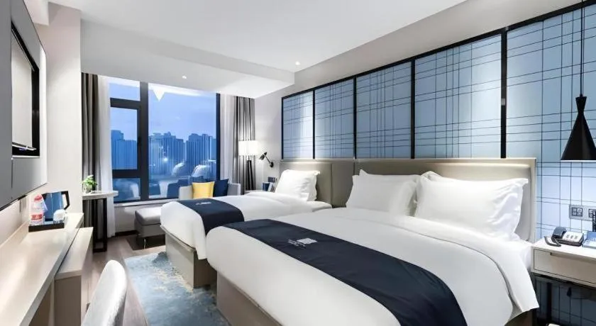 Bed in Echarm Hotel Huzhou Wuyue Plaza Children's Clothing City