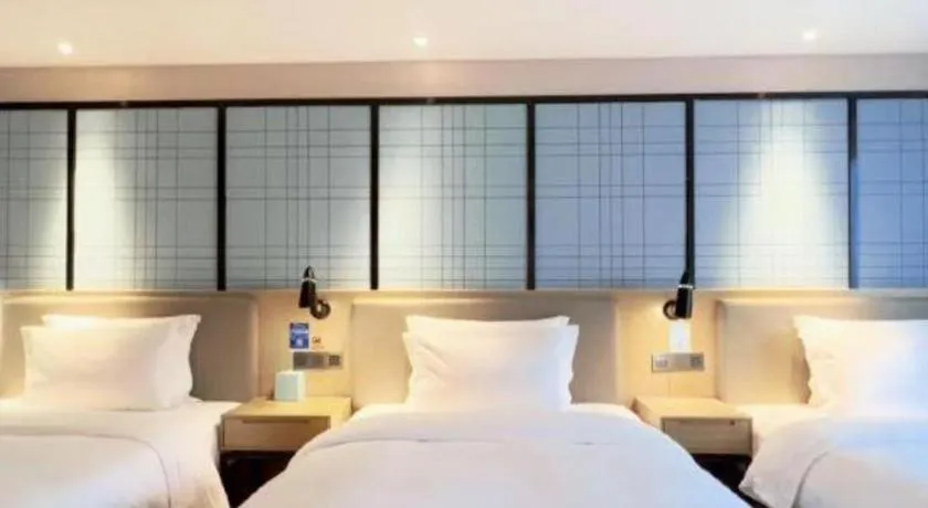 Bed in Echarm Hotel Huzhou Wuyue Plaza Children's Clothing City