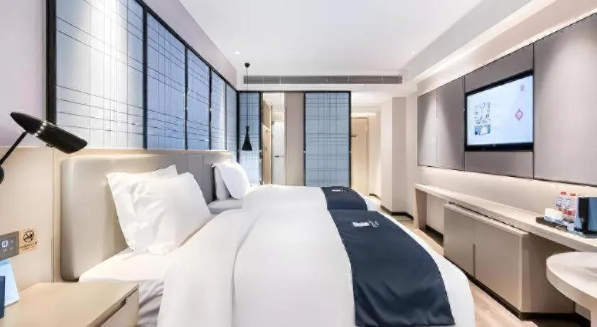 Bed in Echarm Hotel Huzhou Wuyue Plaza Children's Clothing City
