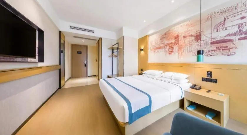 Bed in City Comfort Inn Kunming Flower City Midea Shuncheng Mansion