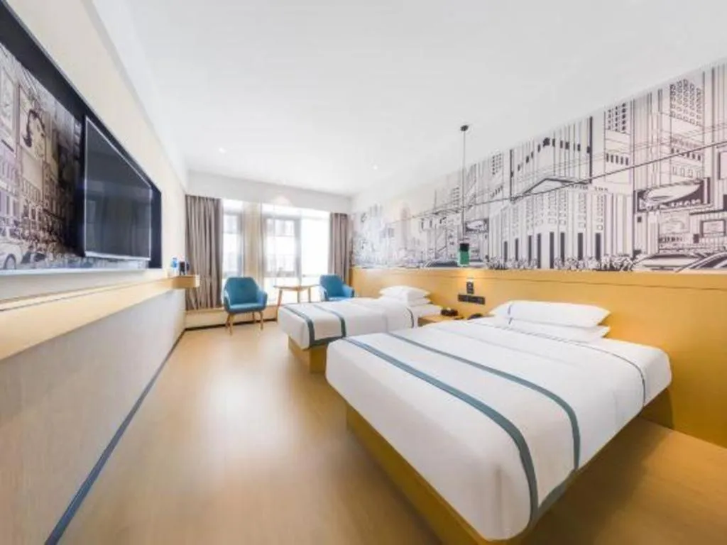 Bed in City Comfort Inn Kunming Flower City Midea Shuncheng Mansion