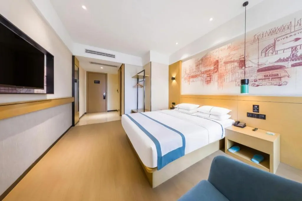 Bed in City Comfort Inn Kunming Flower City Midea Shuncheng Mansion