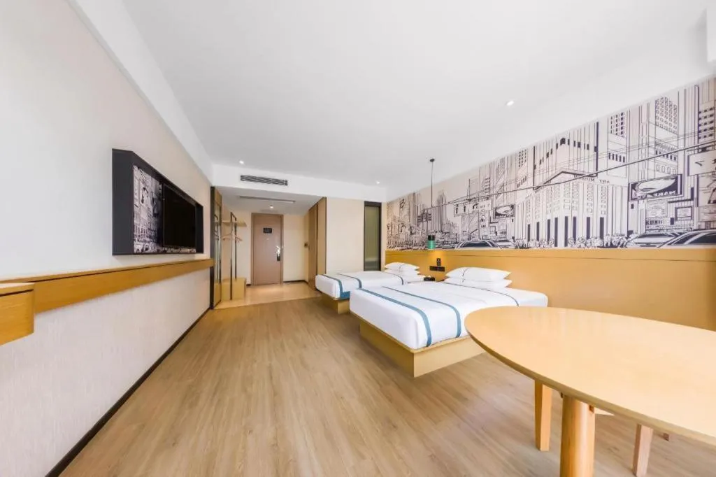 Bed in City Comfort Inn Kunming Flower City Midea Shuncheng Mansion