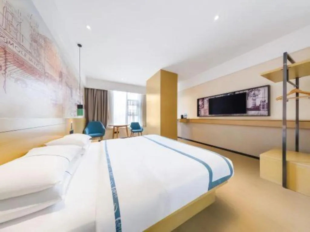 Bed in City Comfort Inn Kunming Flower City Midea Shuncheng Mansion