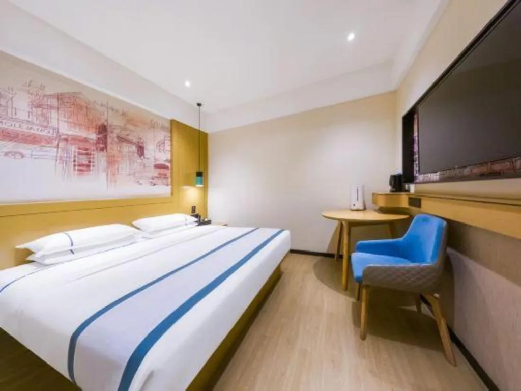 Bed in City Comfort Inn Kunming Flower City Midea Shuncheng Mansion