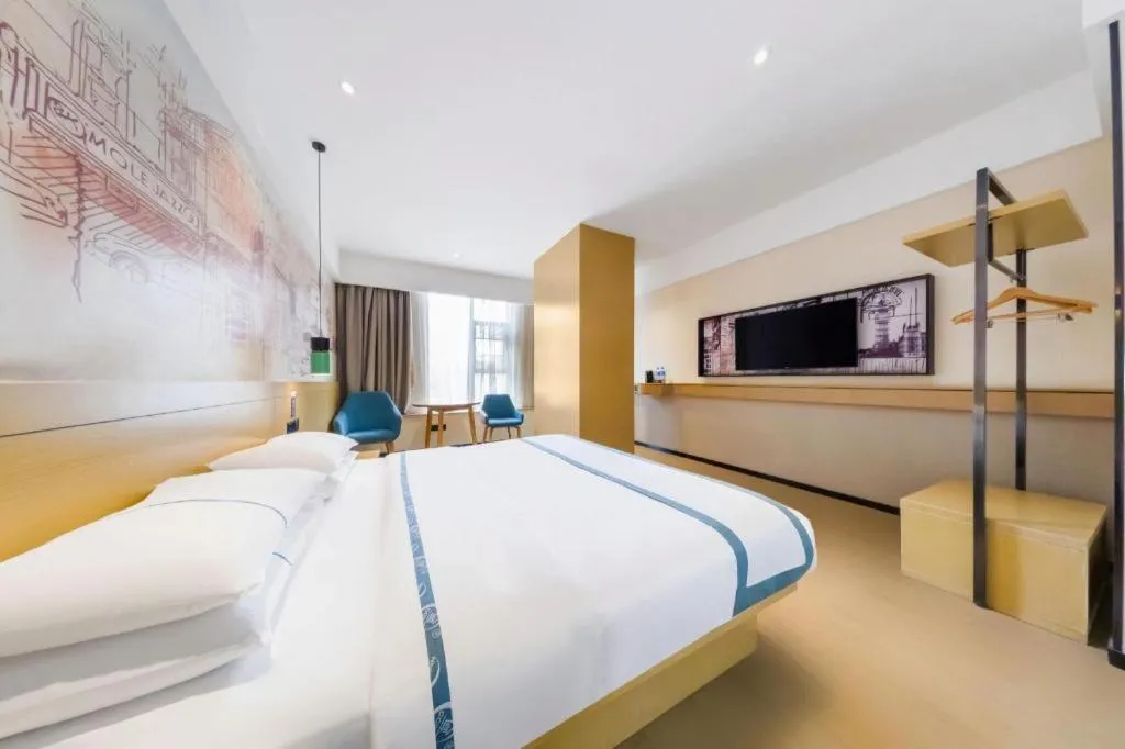 Bed in City Comfort Inn Kunming Flower City Midea Shuncheng Mansion