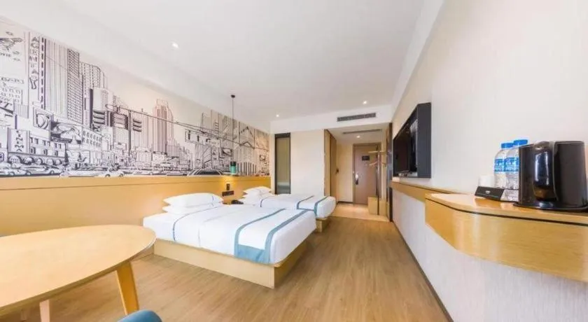 Bed in City Comfort Inn Kunming Flower City Midea Shuncheng Mansion