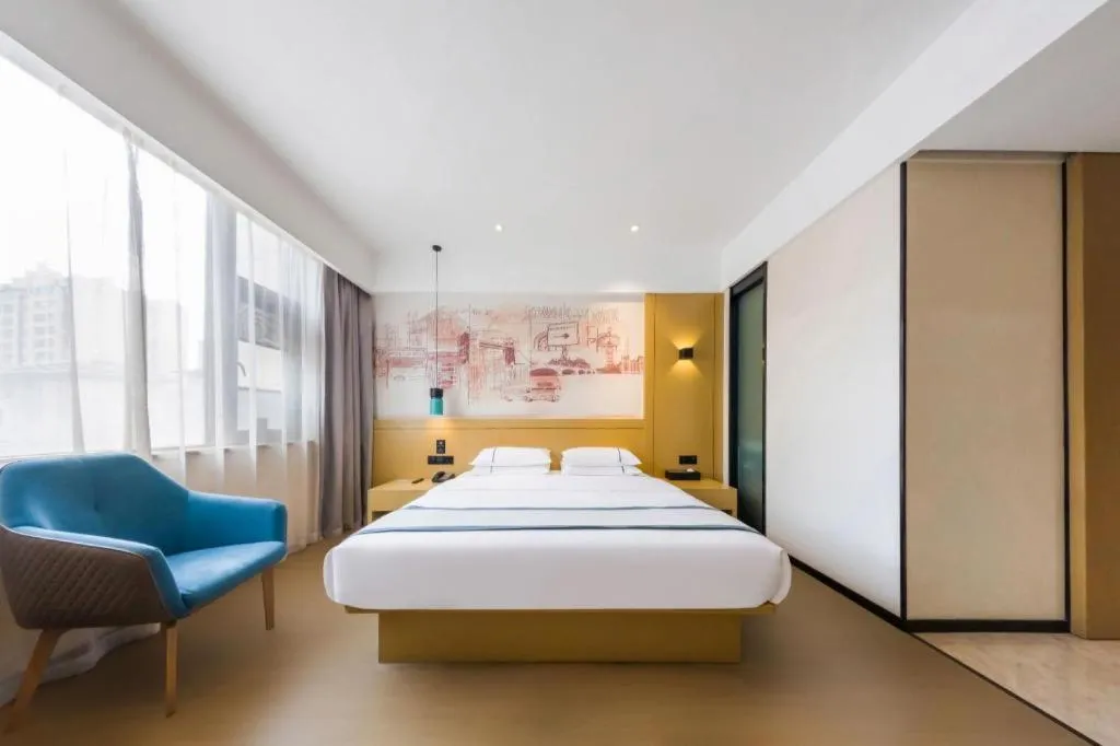 Bed in City Comfort Inn Kunming Flower City Midea Shuncheng Mansion