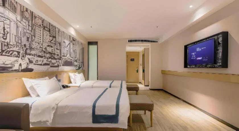 Bed in City Comfort Inn Shiyan High-speed Railway Wanda Plaza