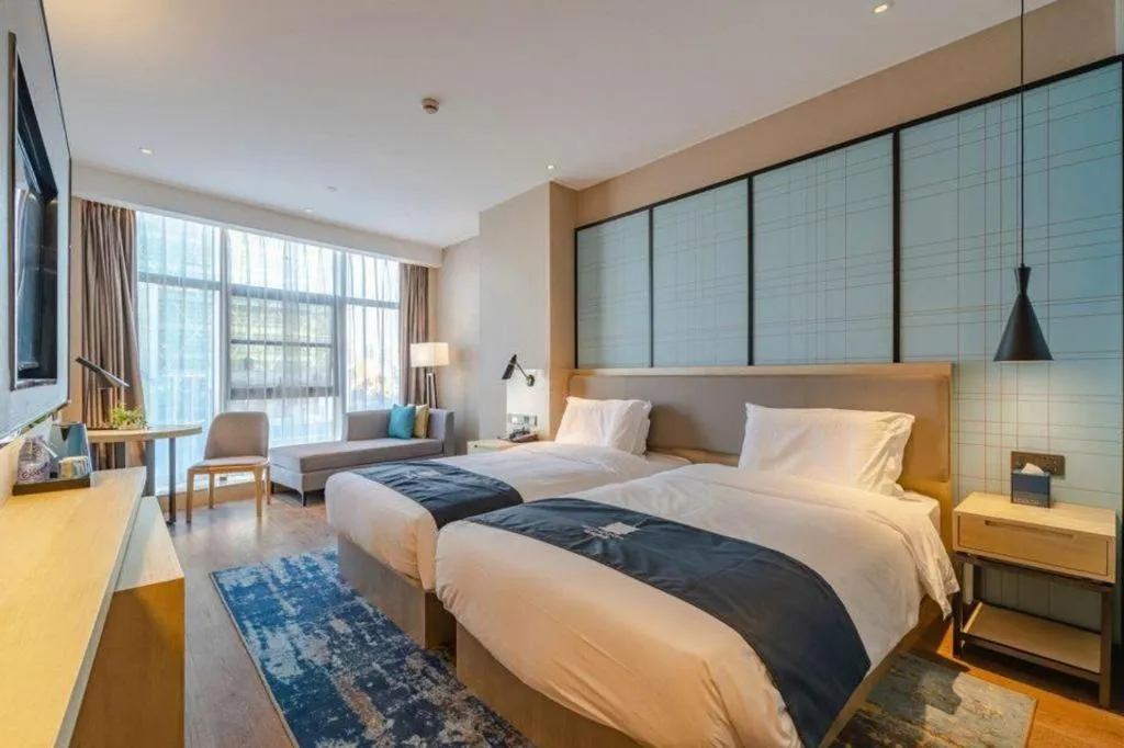 Bed in Echarm Hotel Hefei West Qilitang Metro Station