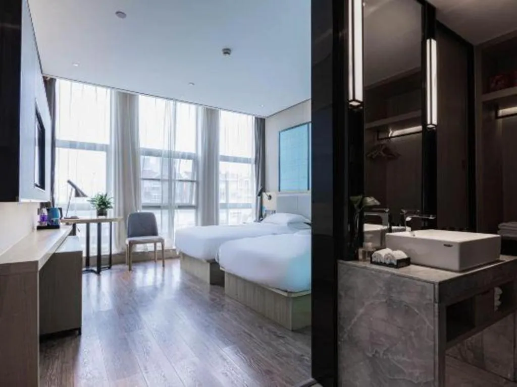 Bed in Echarm Hotel Hefei West Qilitang Metro Station