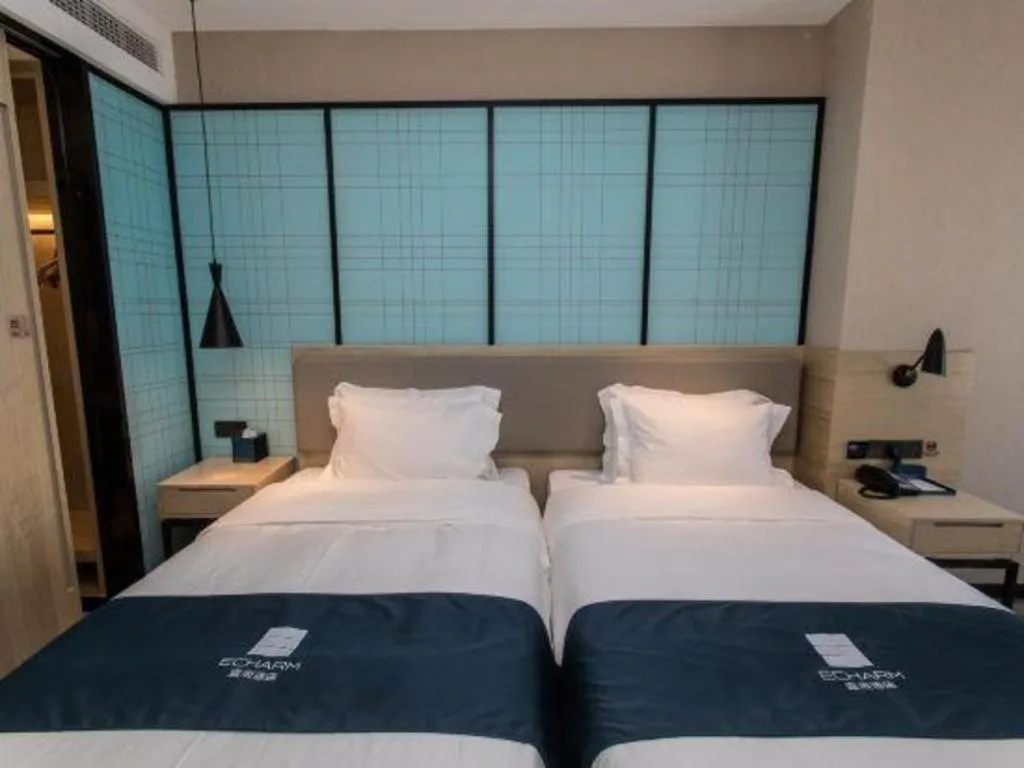 Bed in Echarm Hotel Hefei West Qilitang Metro Station