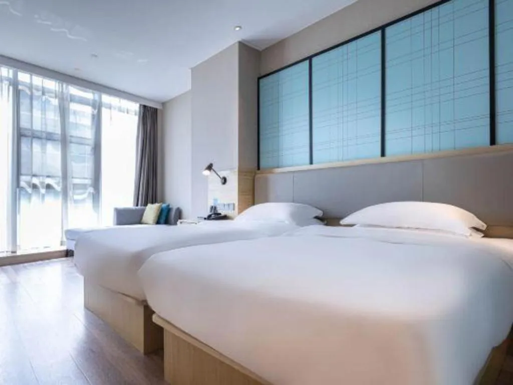 Bed in Echarm Hotel Hefei West Qilitang Metro Station