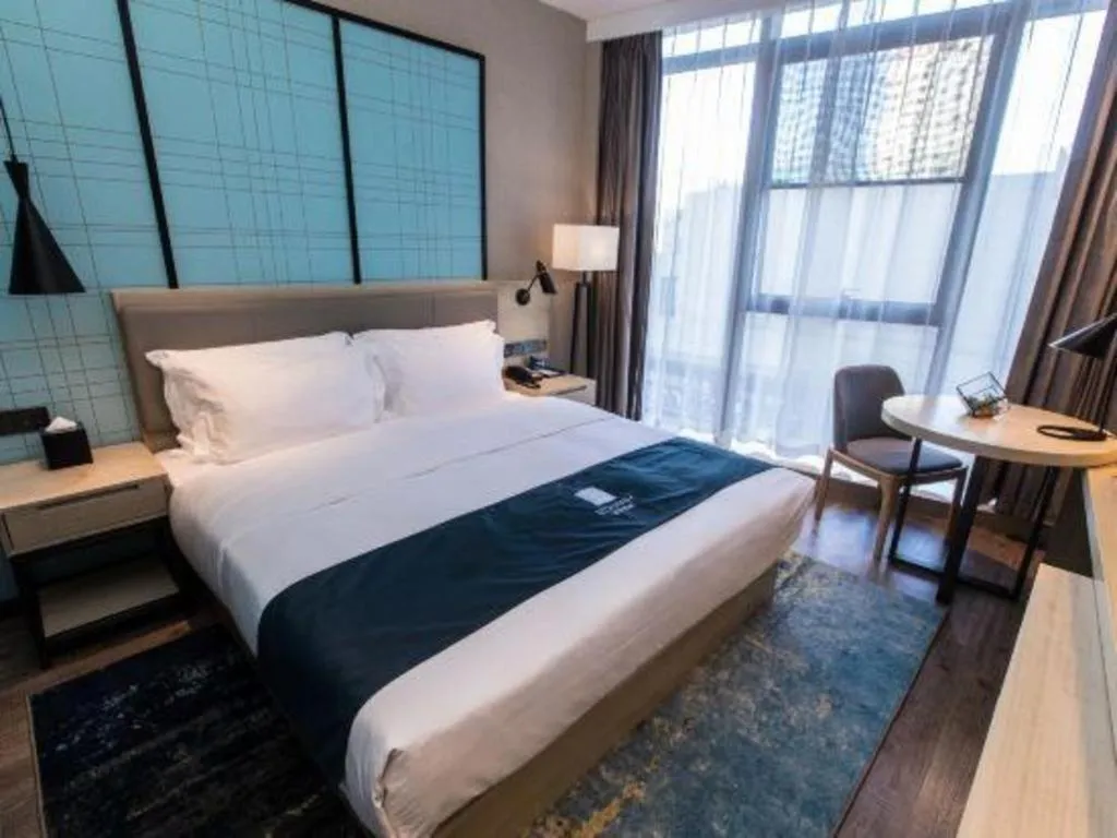 Bed in Echarm Hotel Hefei West Qilitang Metro Station