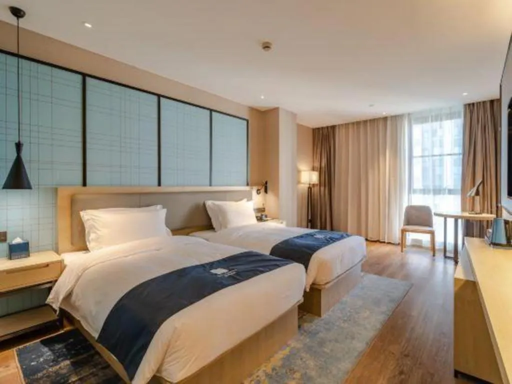 Bed in Echarm Hotel Hefei West Qilitang Metro Station