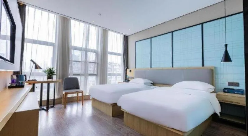 Bed in Echarm Hotel Hefei West Qilitang Metro Station