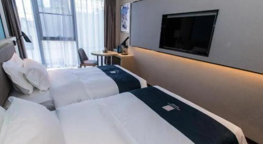 Bed in Echarm Hotel Hefei West Qilitang Metro Station