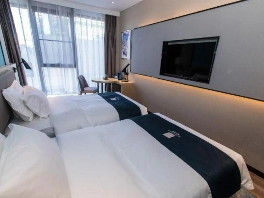 Bed in Echarm Hotel Hefei West Qilitang Metro Station