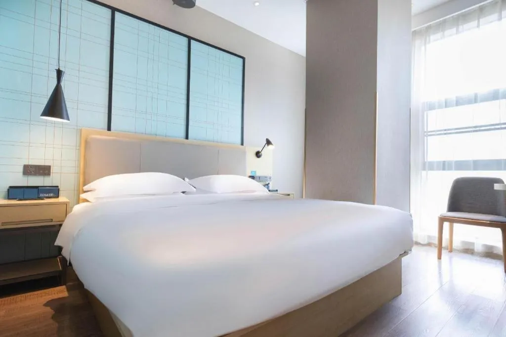Bed in Echarm Hotel Hefei West Qilitang Metro Station