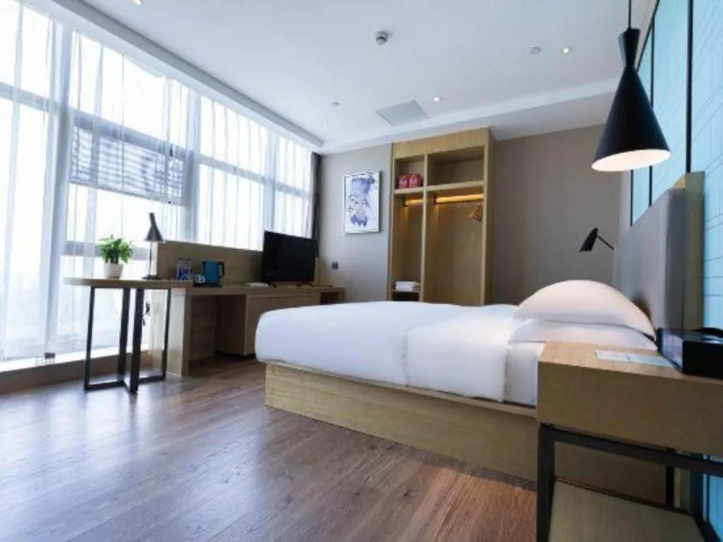 Bed in Echarm Hotel Hefei West Qilitang Metro Station