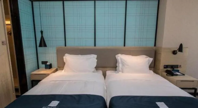 Bed in Echarm Hotel Hefei West Qilitang Metro Station