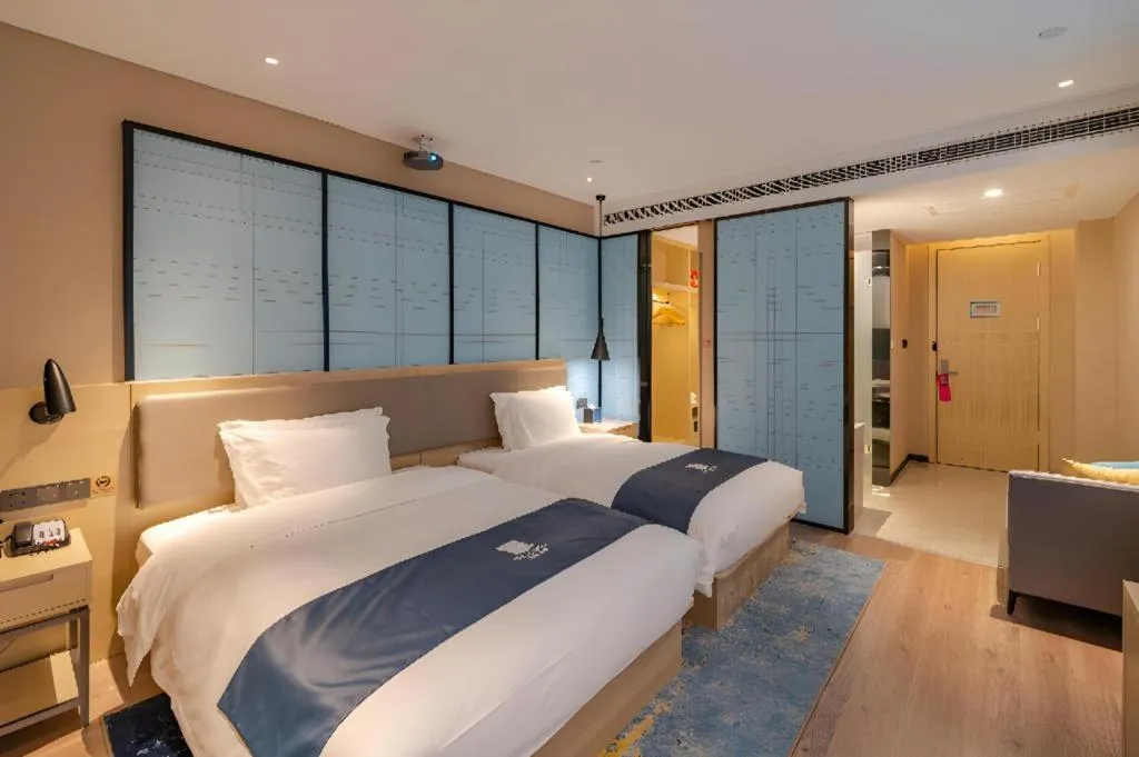 Bed in Echarm Hotel Hefei West Qilitang Metro Station