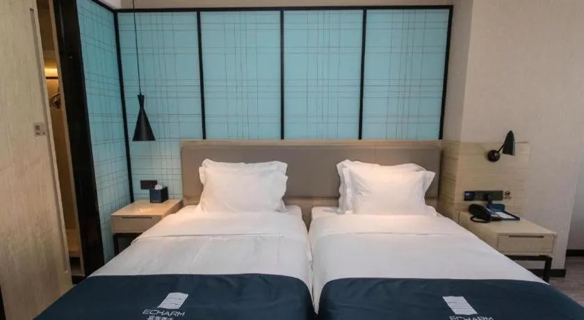 Bed in Echarm Hotel Hefei West Qilitang Metro Station